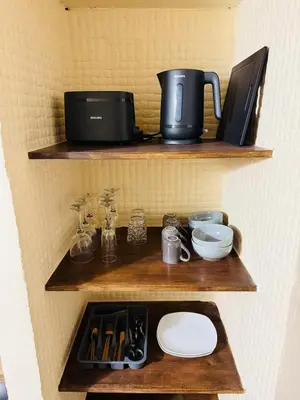 Cuisine ou kitchenette dans l'établissement Le Cupidon & Spa
