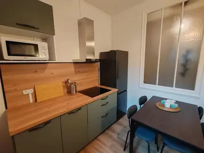 Cuisine ou kitchenette dans l'établissement Le Paladium