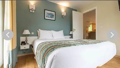 Un ou plusieurs lits dans un hébergement de l'établissement Club Wyndham Normandy, Connelles France