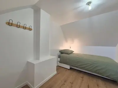 Un ou plusieurs lits dans un hébergement de l'établissement Maison de Ville Climatisée à 10 minutes de Rouen