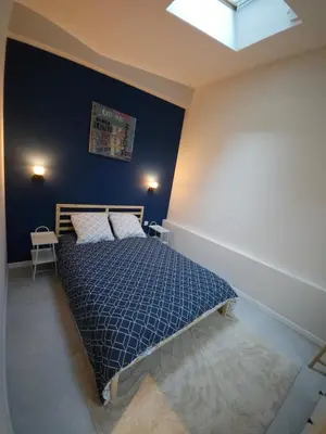 Un ou plusieurs lits dans un hébergement de l'établissement Loft moderne avec garage dans l'hyper centre