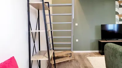 Télévision ou salle de divertissement dans l'établissement Le Duplex du Moulin - Maison T2 cosy centre-ville