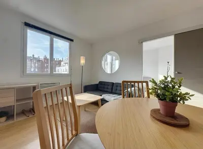 Coin salon dans l'établissement Appartement