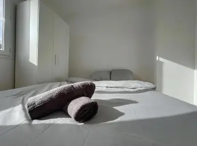 Un ou plusieurs lits dans un hébergement de l'établissement Appartement