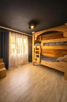 Un ou plusieurs lits dans un hébergement de l'établissement Auvers Wood lodge