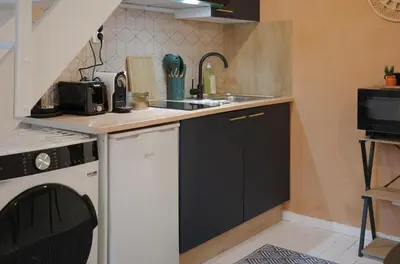 Cuisine ou kitchenette dans l'établissement Le Duplex Cosy