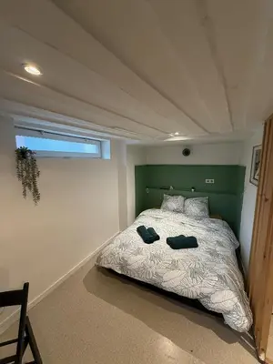 Un ou plusieurs lits dans un hébergement de l'établissement Studio Cosy Place Vieux Marché