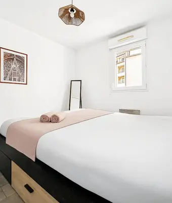 Un ou plusieurs lits dans un hébergement de l'établissement T2 moderne terrasse, parking, proche commerces