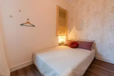 Un ou plusieurs lits dans un hébergement de l'établissement Cozy Rouen