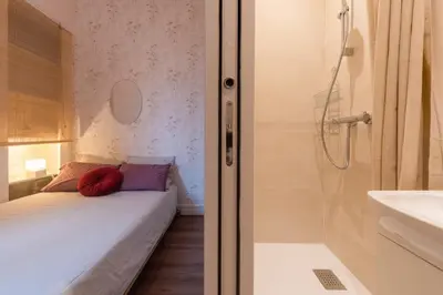 Un ou plusieurs lits dans un hébergement de l'établissement Cozy Rouen