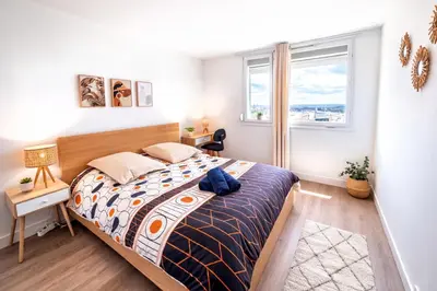 Un ou plusieurs lits dans un hébergement de l'établissement Spacieux et moderne 3 chambres a 10 min de Rouen