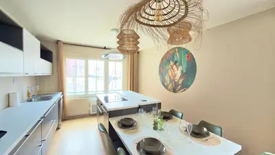 Télévision ou salle de divertissement dans l'établissement Abyssea - Appartement Chic Centre-Ville & Netflix