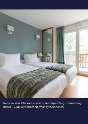 Un ou plusieurs lits dans un hébergement de l'établissement Club Wyndham Normandy is a 3-star aparthotel-style