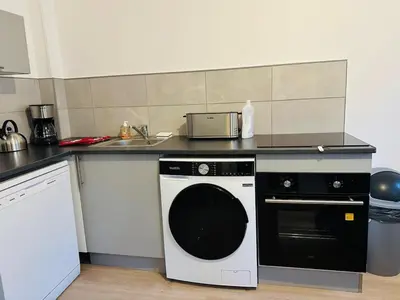 Cuisine ou kitchenette dans l'établissement Maison Sottevillaise - 423