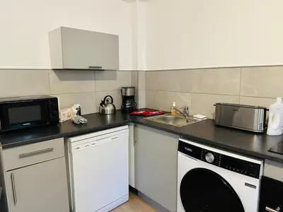 Cuisine ou kitchenette dans l'établissement Maison Sottevillaise - 423