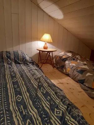 Un ou plusieurs lits dans un hébergement de l'établissement Studio du Clos Cadoux