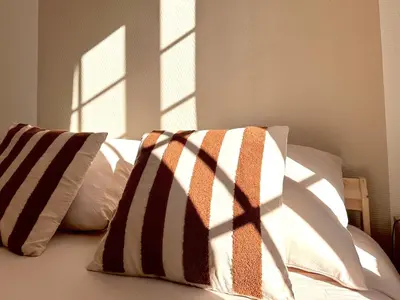 Un ou plusieurs lits dans un hébergement de l'établissement Le Clocher - 1 Chambre - Wifi