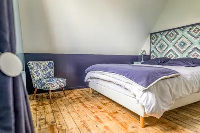 Un ou plusieurs lits dans un hébergement de l'établissement Belle Époque Villa With Hot Tub In Forges-Les-Eaux