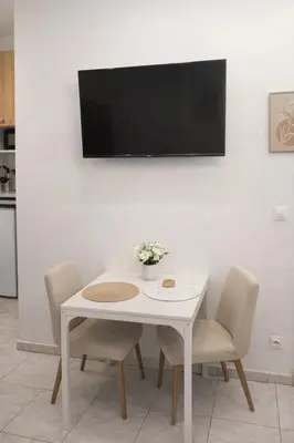 Télévision ou salle de divertissement dans l'établissement Duplex moderne et lumineux