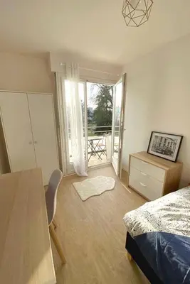 Un ou plusieurs lits dans un hébergement de l'établissement Coloc studio standing mueble netflix gare