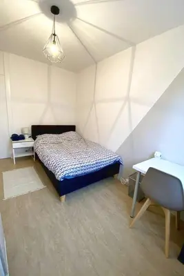 Un ou plusieurs lits dans un hébergement de l'établissement Coloc studio standing mueble netflix gare