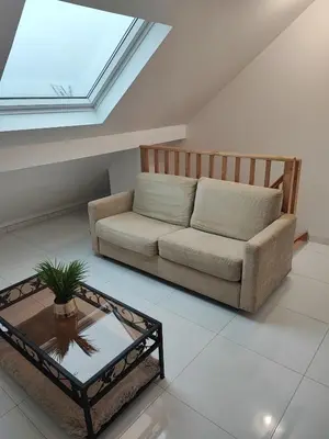 Coin salon dans l'établissement Apartment G