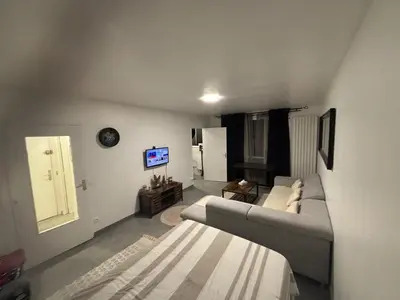 Un ou plusieurs lits dans un hébergement de l'établissement Studio 30 m2 Chantilly