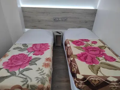 Un ou plusieurs lits dans un hébergement de l'établissement Alpha Hotel