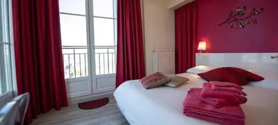 Un ou plusieurs lits dans un hébergement de l'établissement Le 360 TOUR PERRET 19eme PANORAMA 4 ETOILES