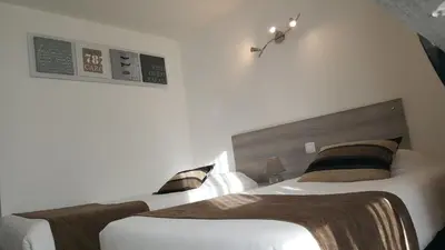 Un ou plusieurs lits dans un hébergement de l'établissement Hôtel Eclipse