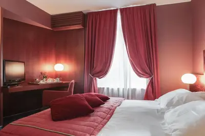 Un ou plusieurs lits dans un hébergement de l'établissement Hôtel & Restaurant Le Relais d'Aumale