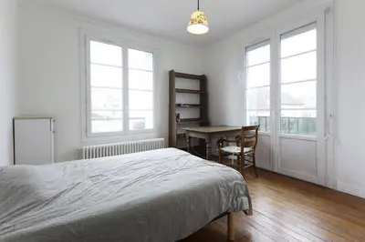 Un ou plusieurs lits dans un hébergement de l'établissement Chambres meublées chez l'habitant dans appartement proche gare sncf