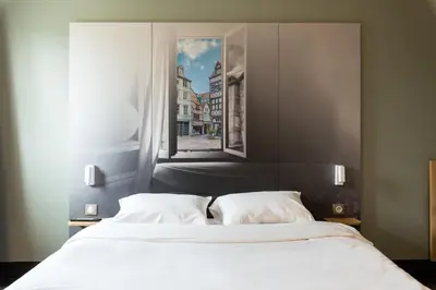 Un ou plusieurs lits dans un hébergement de l'établissement B&B HOTEL Rouen Saint-Étienne-du-Rouvray