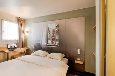 Un ou plusieurs lits dans un hébergement de l'établissement B&B HOTEL Rouen Parc des Expos Zénith