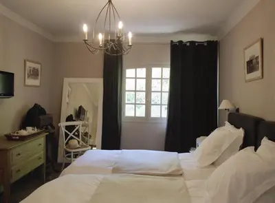 Un ou plusieurs lits dans un hébergement de l'établissement Hôtel La Licorne & Spa