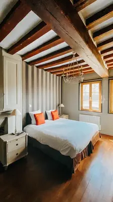 Un ou plusieurs lits dans un hébergement de l'établissement Hôtel La Licorne & Spa