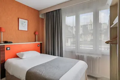 Un ou plusieurs lits dans un hébergement de l'établissement Urban Style hotel de l'Europe