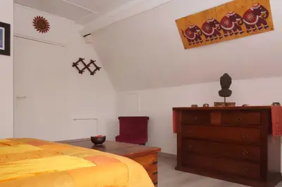 Un ou plusieurs lits dans un hébergement de l'établissement Chambre D'Hôtes le Phenix