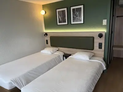 Un ou plusieurs lits dans un hébergement de l'établissement Campanile Rouen Nord - Mont-Saint-Aignan