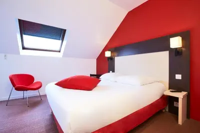 Un ou plusieurs lits dans un hébergement de l'établissement KYRIAD ROUEN NORD - Mont Saint Aignan