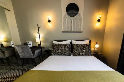 Un ou plusieurs lits dans un hébergement de l'établissement Hôtel Paulette Rouen Centre Cathédrale