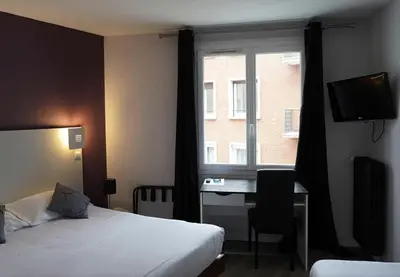 Un ou plusieurs lits dans un hébergement de l'établissement Hotel De Quebec