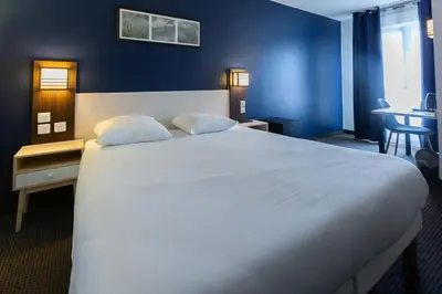 Un ou plusieurs lits dans un hébergement de l'établissement HOTEL l'EAUBONNE