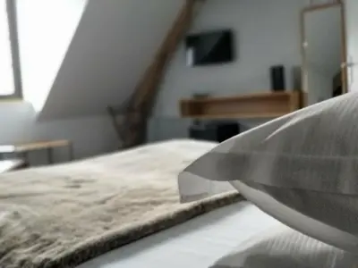 Un ou plusieurs lits dans un hébergement de l'établissement Clos Masure hôtel de campagne