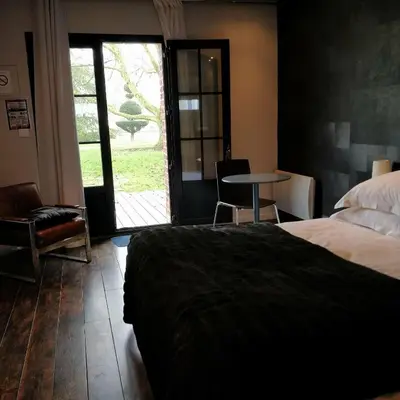 Un ou plusieurs lits dans un hébergement de l'établissement Clos Masure hôtel de campagne