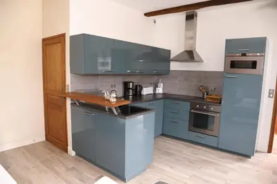 Cuisine ou kitchenette dans l'établissement Maison de l'horloge