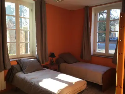 Un ou plusieurs lits dans un hébergement de l'établissement Maison de l'horloge