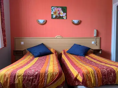Un ou plusieurs lits dans un hébergement de l'établissement Hotel du Haut Marais
