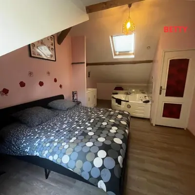 Un ou plusieurs lits dans un hébergement de l'établissement Le petit manoir