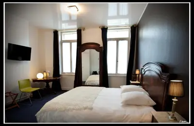 Un ou plusieurs lits dans un hébergement de l'établissement Hotel Le Prieuré et La Résidence